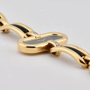 BOUCHERON LADY'S YELLOW GOLD AND ONYX