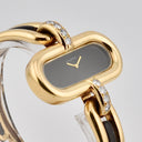BOUCHERON LADY'S YELLOW GOLD AND ONYX